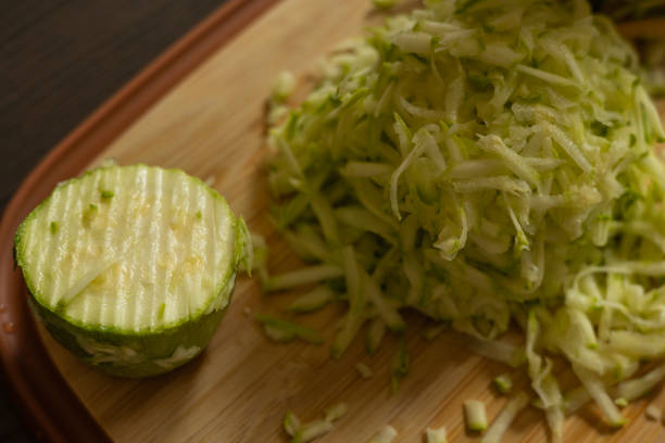 istock Shredded Zucchini on a Cutting Board Close-Up on Dark Background 2174927762