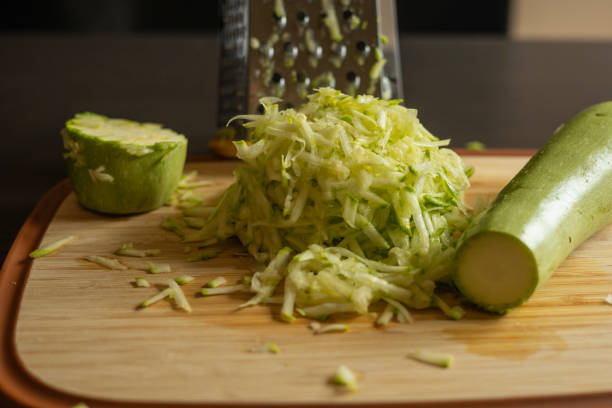 istock Shredded Zucchini on a Cutting Board Close-Up on Dark Background 2174927765