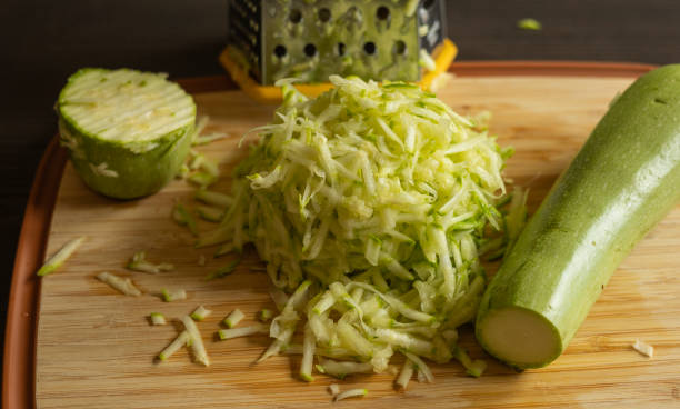 istock Shredded Zucchini on a Cutting Board Close-Up on Dark Background 2174927770