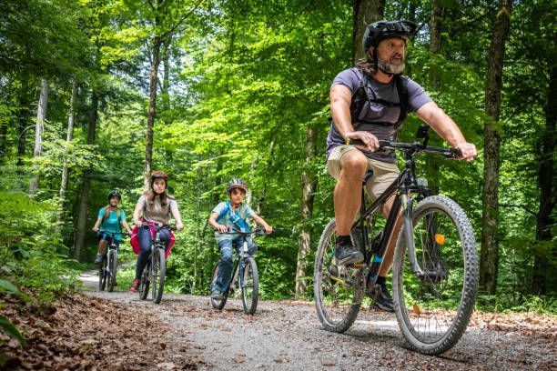 istock Active Family Cycle Adventure in Forest Setting 2174928363