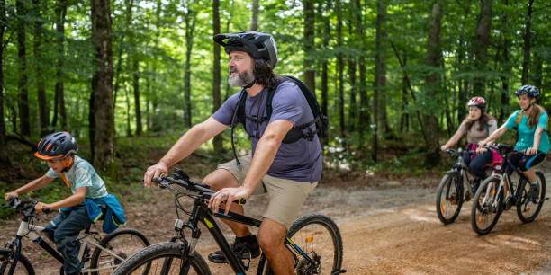 istock Active Family Cycling Adventure in Forest 2174928367