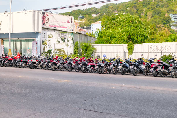 Phuket, Thailand - April 26, 2024: mopeds or motorbikes parked on Patong Street