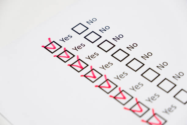 mark Yes checkboxes with red on checklist on white paper