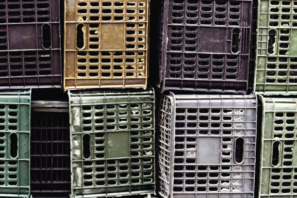Plastic fruit crates in warehouse.