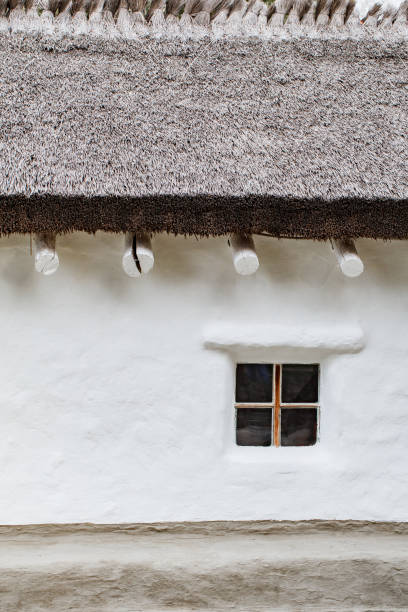 istock thatched roof and window in an ancient house 2174939116