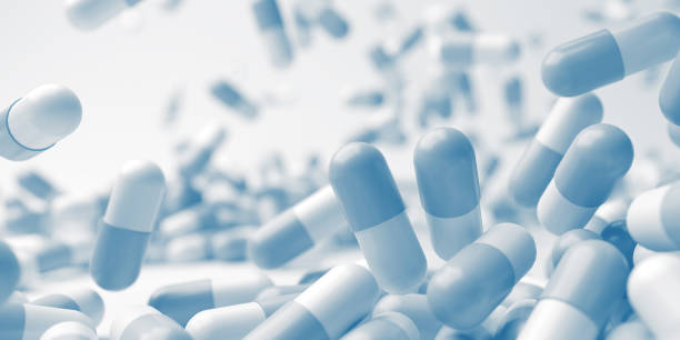 istock White blue pills close up. Development medicine and pharmacology 2174939353