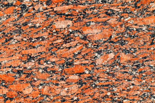 istock texture of natural polished dark red granite background close-up 2174939973