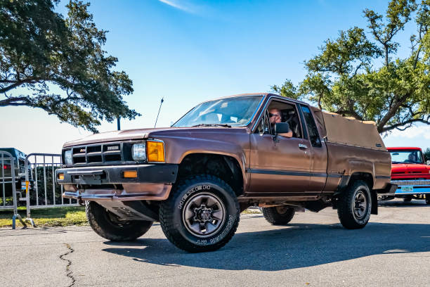Gulfport, MS - October 02, 2023: Low perspective front corner view of a 1986 Toyota XtraCab Deluxe Pickup at a local car show.