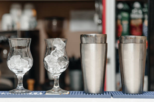 istock two glasses with ice and two cocktail shakers 2174945193