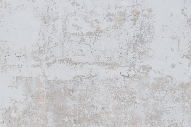 istock grey wall of old house with scratched plaster 2174945256