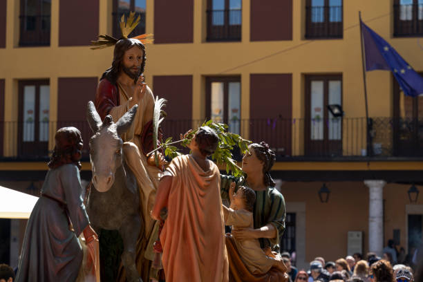 istock Palm Sunday Procession with Jesus riding on a donkey 2174946284