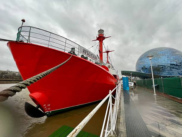 Kaliningrad, Russia - December 29, 2023:  Floating Lighthouse docked in Kaliningrad in front of Museum of The World Oceans