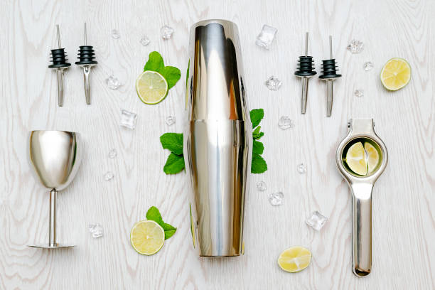 istock Shaker,glass,squeezer,bartender tools.mojito lemonade drink, alcohol cocktail with lime,mint leaves 2174956514