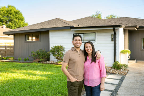istock Empty nesters portrait in front of their home 2174974147
