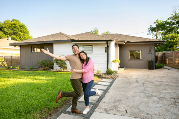 istock Empty nesters portrait in front of their home 2174976573