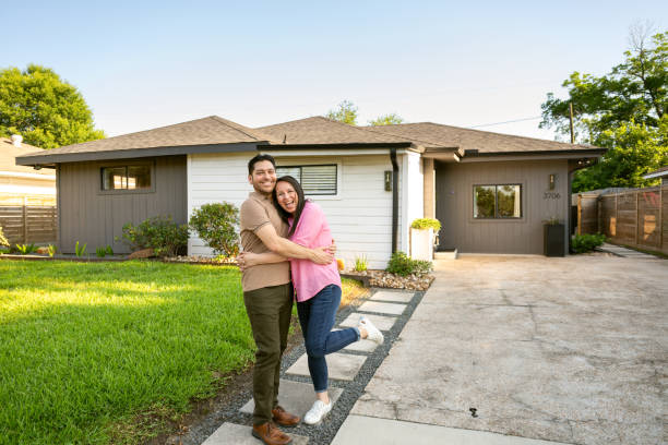 istock Empty nesters portrait in front of their home 2174978314