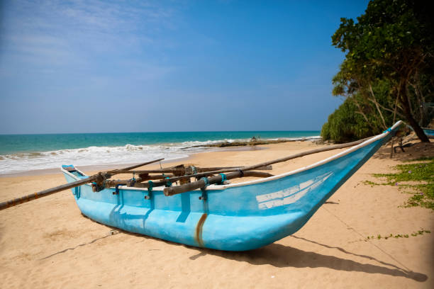 Handcrafted fishing boat on a beach south of Columbo