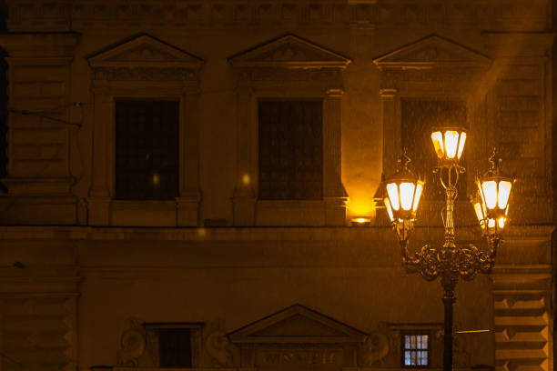 Closeup of lantern on Market square in Lviv, Ukraine at rainy night