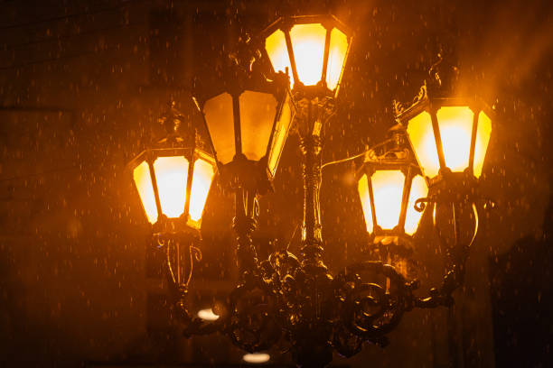 Belgrade, Serbia - September 25, 2015: People walking on the busy Knez Mihailova street by night with lights reflecting on wet cobblestone after the rain