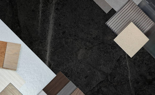 istock top view of interior material samples board contains ash vinyl flooring tile, stone ceramic tiles, interior fabric wallpapers, wooden laminated flooring placed on dark black marble table. 2174989589