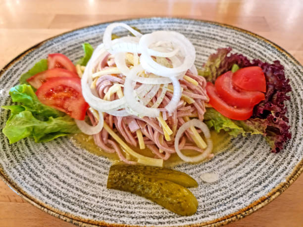 Traditional Swiss sausage salad on a dinner plate.