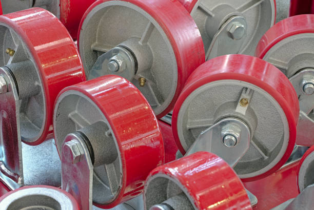 Large group of various spare wheels for cargo trolleys or shopping carts, warehouse equipment