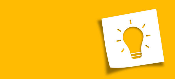 istock Light bulb big idea concept with note paper on yellow background. 2174998864