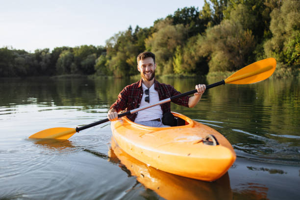 istock Cheerful Handsome Man Kayaking at Sunset with a Radiant Smile 2175012254