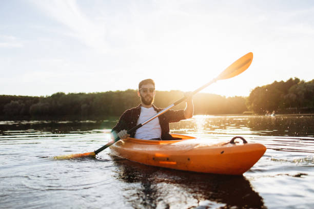 istock Handsome Man Enjoying Kayaking Alone at Sunset 2175012967