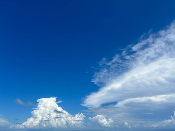 istock Stunning cloud formations in a bright blue sky over the ocean at midday 2175028405