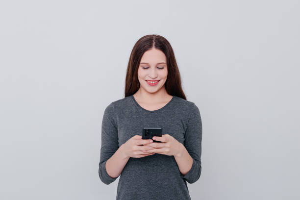 istock young woman with smartphone 2175031243