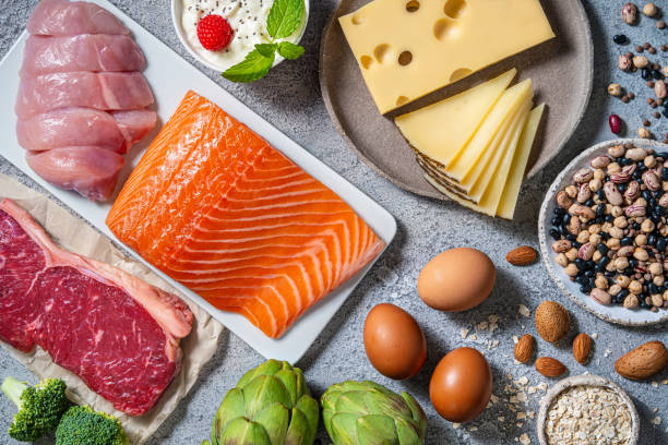 istock Assorted healthy protein source food good for body building: fish, meat, cheese, beans, eggs. 2175031444