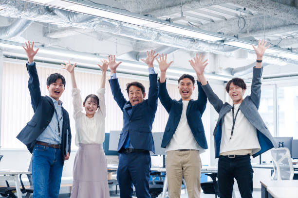 istock Business people jumping for joy in the office. 2175034547