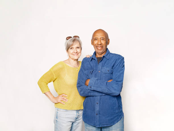 Senior Mixed race couple against white background