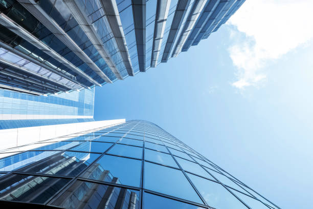 istock Modern glass skyscrapers reflecting blue sky 2175039870