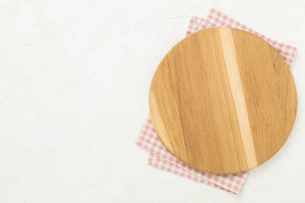 istock Cutting board with napkin on concrete background, top view 2175044135