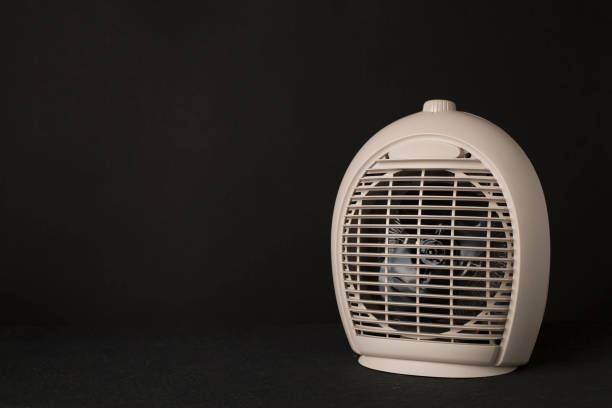istock Portable electric heater on black background 2175044160