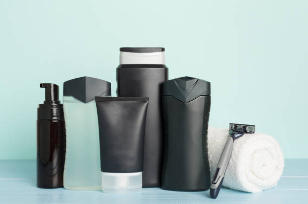 istock Men cosmetic bottles with mint leaves on wooden table 2175044202
