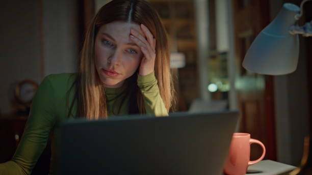 istock Overworked freelancer rubbing eyes looking on laptop screen late evening closeup 2175048619