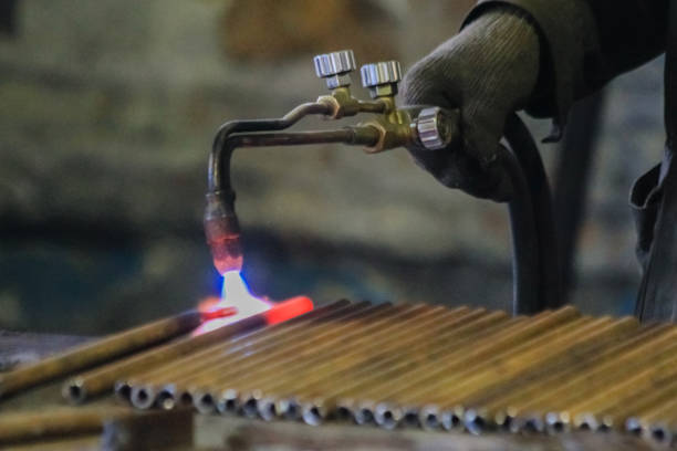 istock A man's hand holds a metal cutting torch and warms pipes with it 2175050798