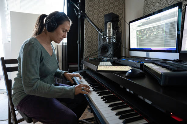 istock Musician Recording Piano Theme in Home Music Studio 2175050930