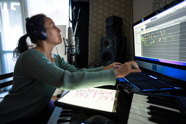 istock Woman Playing on MIDI Drum Pad Controller in Music Studio, Close-Up 2175050932