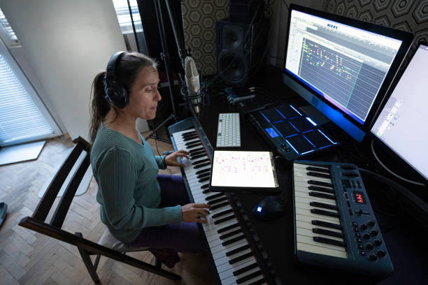 istock Musician Recording Piano Theme in Home Music Studio 2175050933