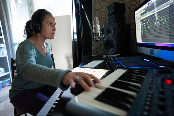 istock Musician Recording Piano Theme in Home Music Studio 2175050934