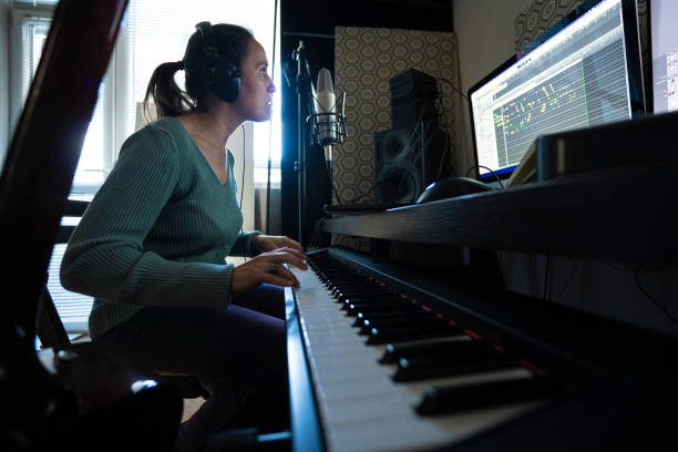 istock Musician Recording Piano Theme in Home Music Studio 2175050935