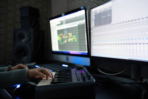 istock Hands Playing on MIDI Keyboard in Home Music Studio, Close-Up 2175050941
