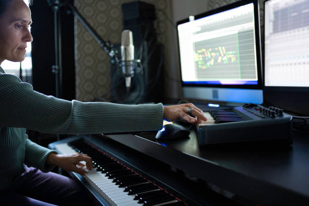 istock Musician Recording Piano Theme in Home Music Studio 2175050943