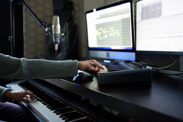 istock Hands Playing on MIDI Keyboard in Home Music Studio, Close-Up 2175050951