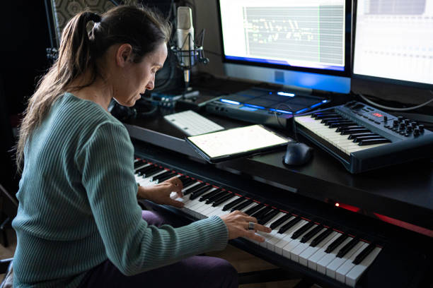 istock Musician Recording Piano Theme in Home Music Studio 2175050959
