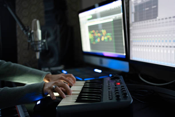 istock Hands Playing on MIDI Keyboard in Home Music Studio, Close-Up 2175051374